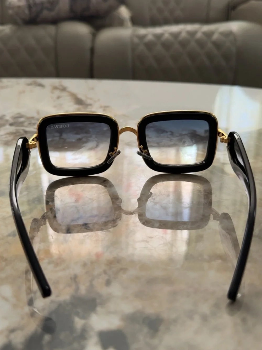 Loewe Black Sunglasses with Gold Accents and Gradient Lenses